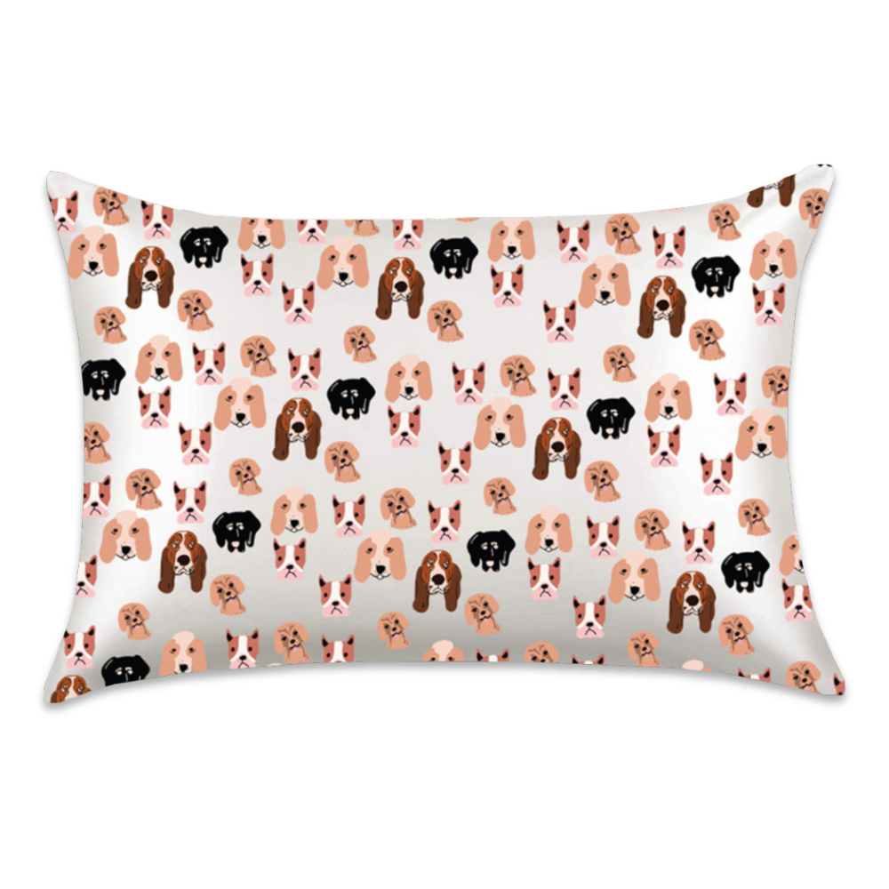 Dogs satin pillowcase featuring illustrated dog faces in tan, brown, pink, and black on a white background.