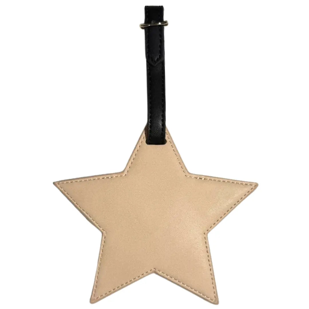 A star-shaped beige leather luggage tag with a black leather strap and silver metal ring, shown against a plain white background.