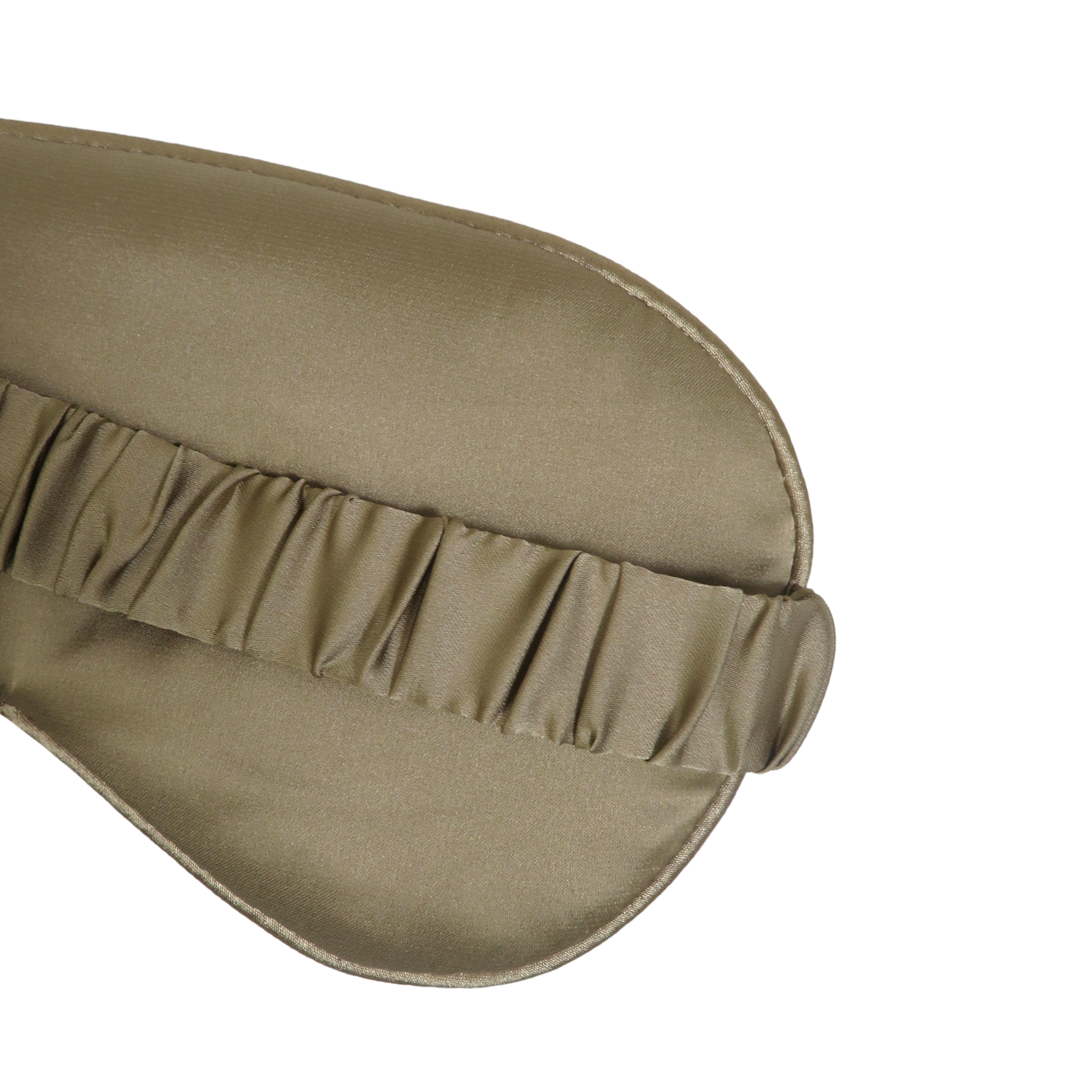 Close-up of a taupe sleep mask with a gathered elastic band, shown on a plain white background.
