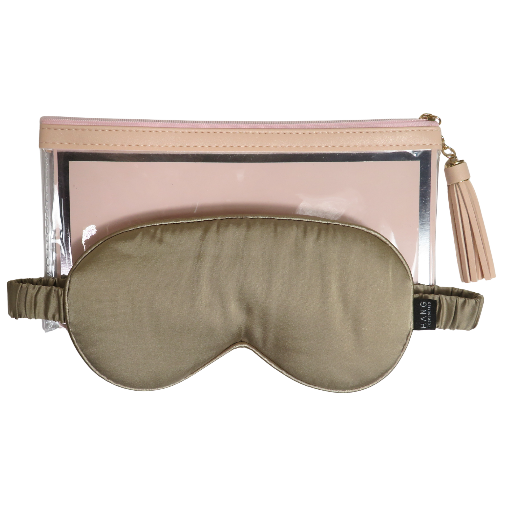 A taupe satin sleep mask with an elastic strap, displayed in front of a clear zippered pouch with a light pink lining and gold zipper pull, on a solid white background.
