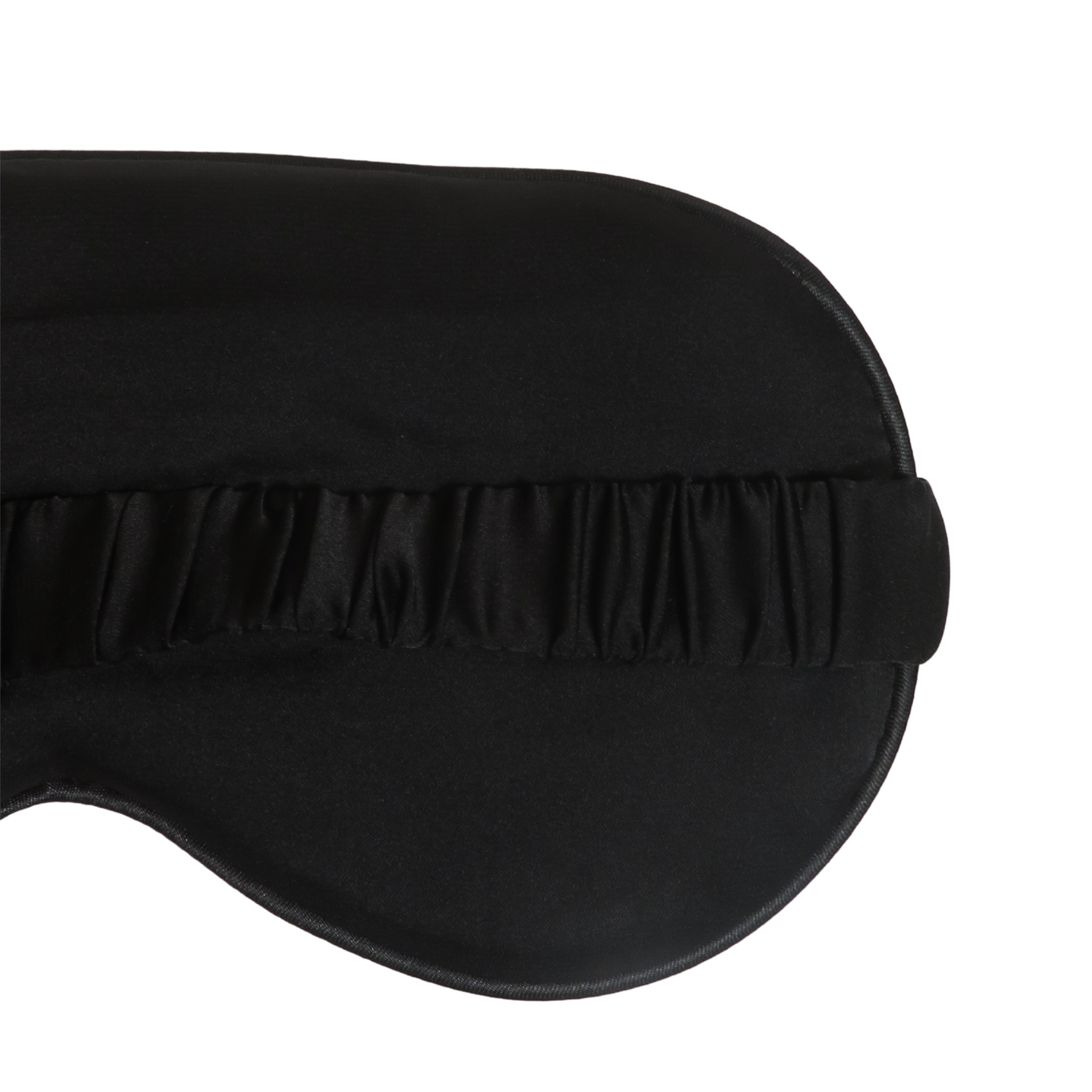 Close-up of a black satin sleep mask with a gathered elastic strap on a plain white background.