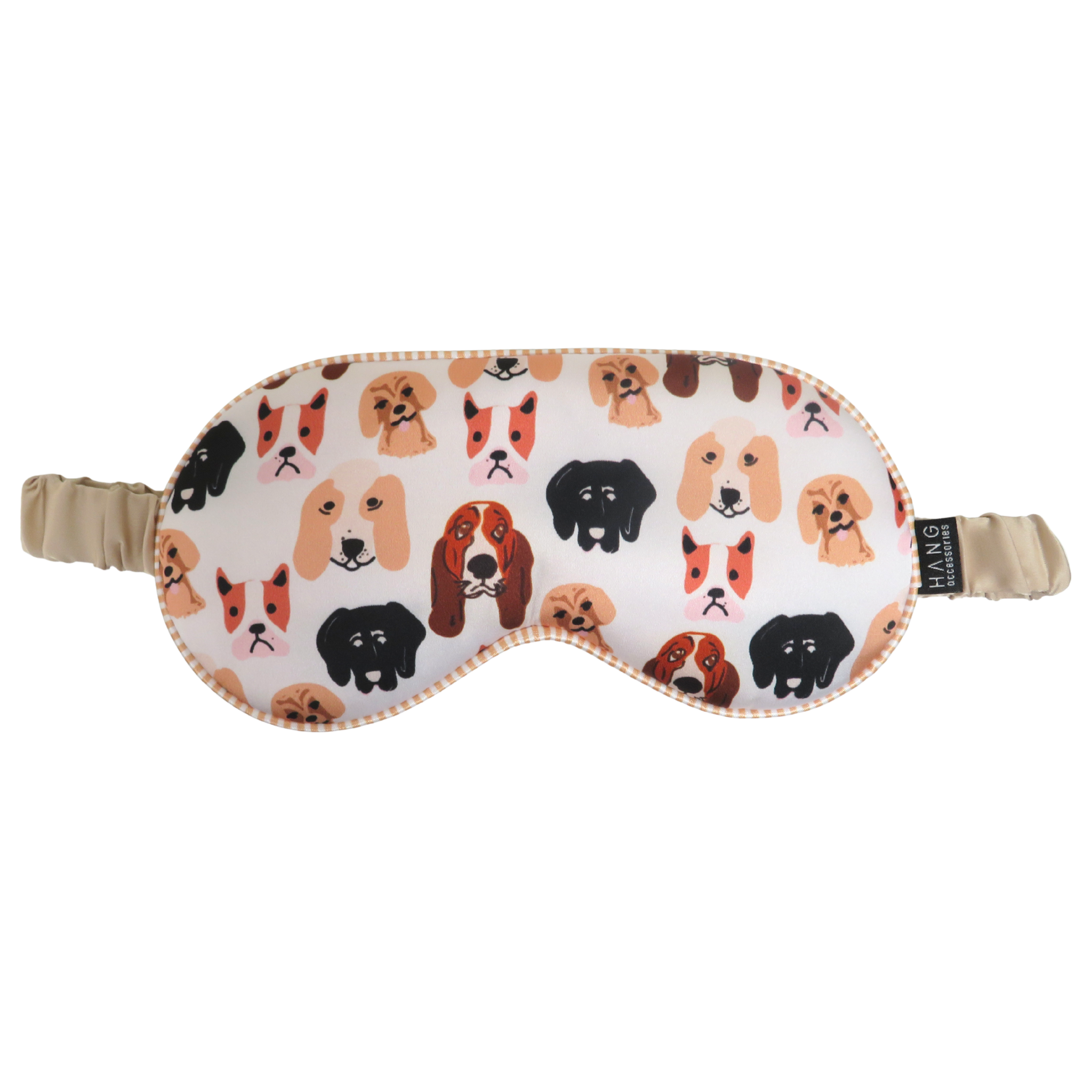 A sleep mask with an all-over pattern of different dog faces on a white background, featuring beige elastic straps.