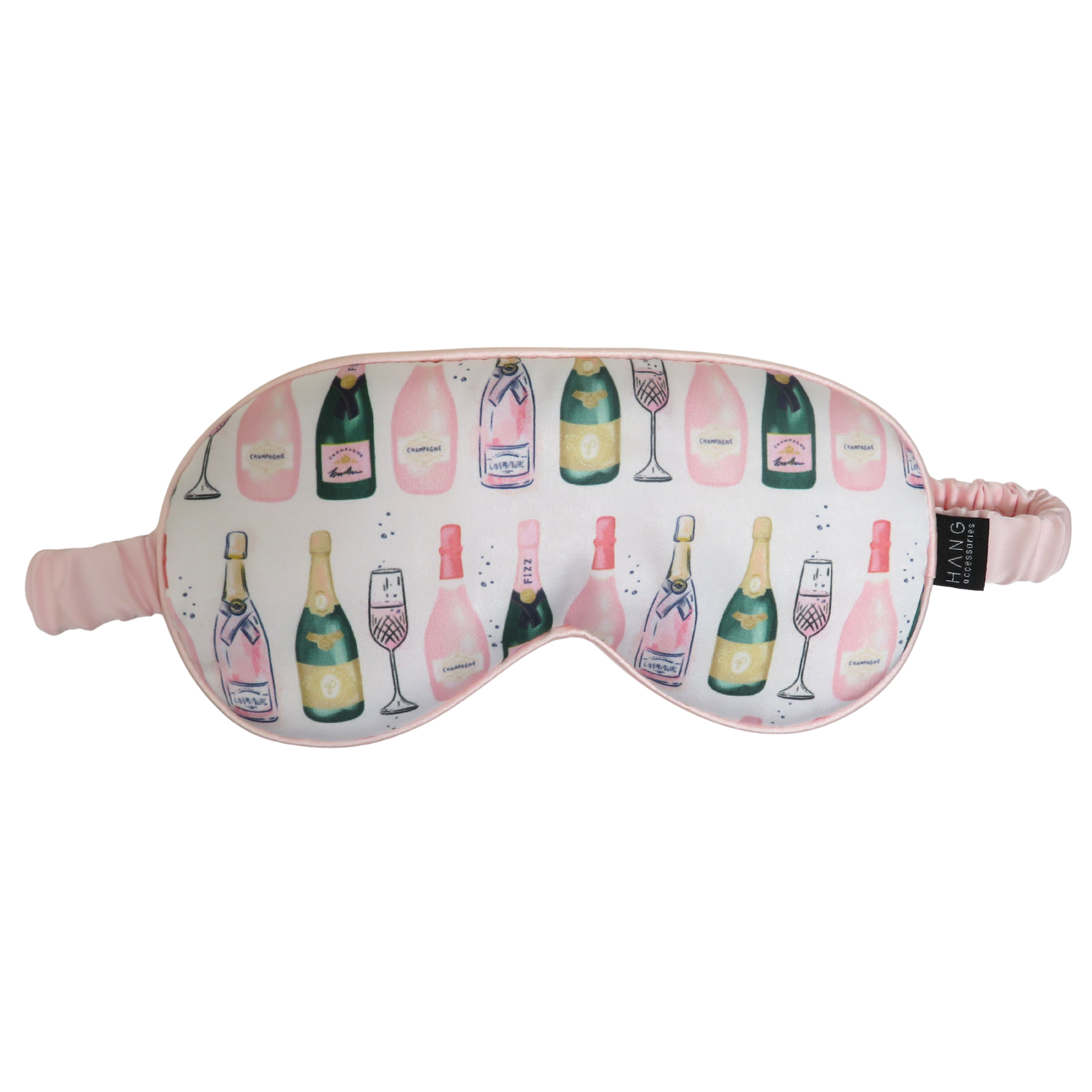 A pink sleep mask with a champagne bottle and glass pattern, featuring a pink elastic strap.