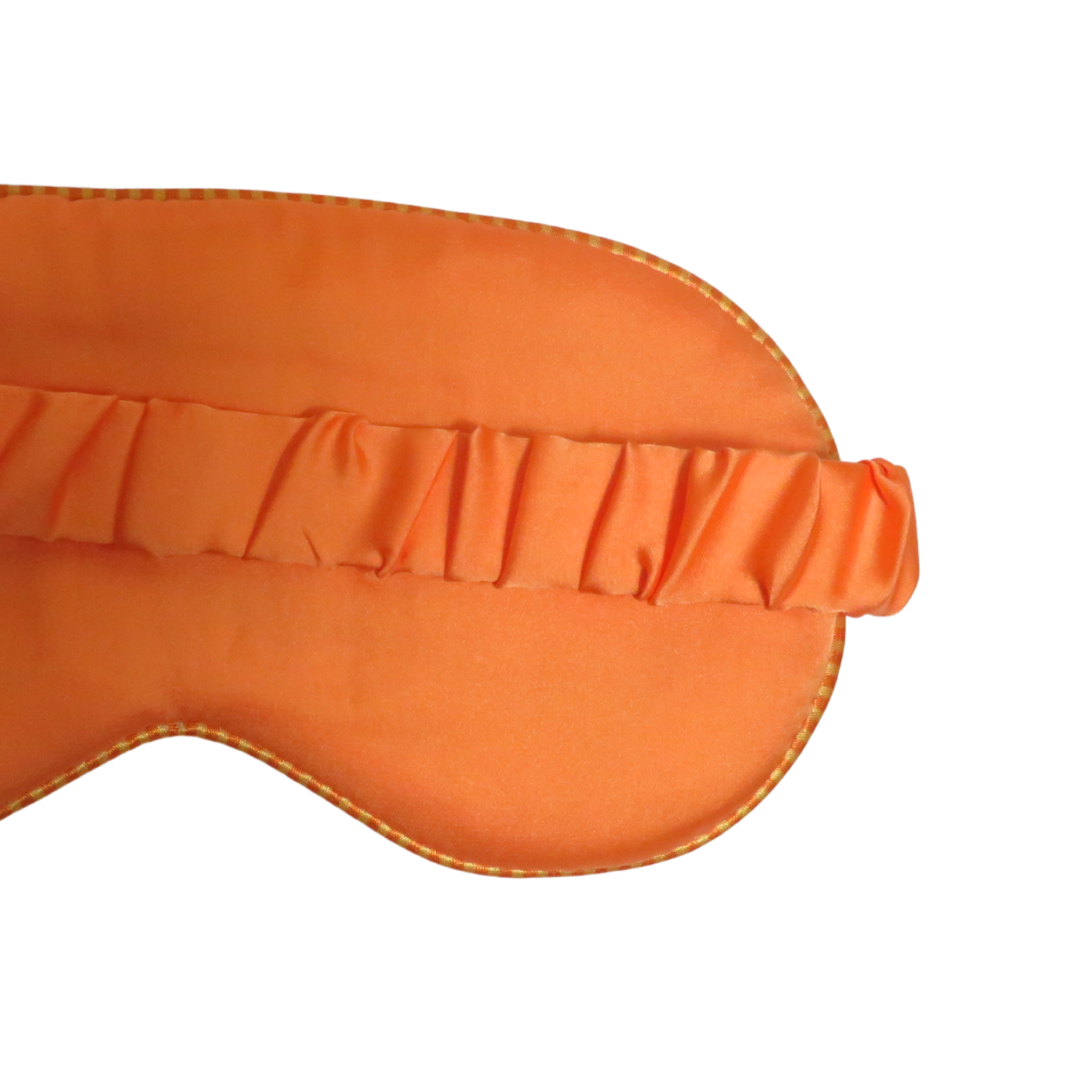 Close-up of an orange satin sleep mask with a ruffled elastic band on a plain white background.