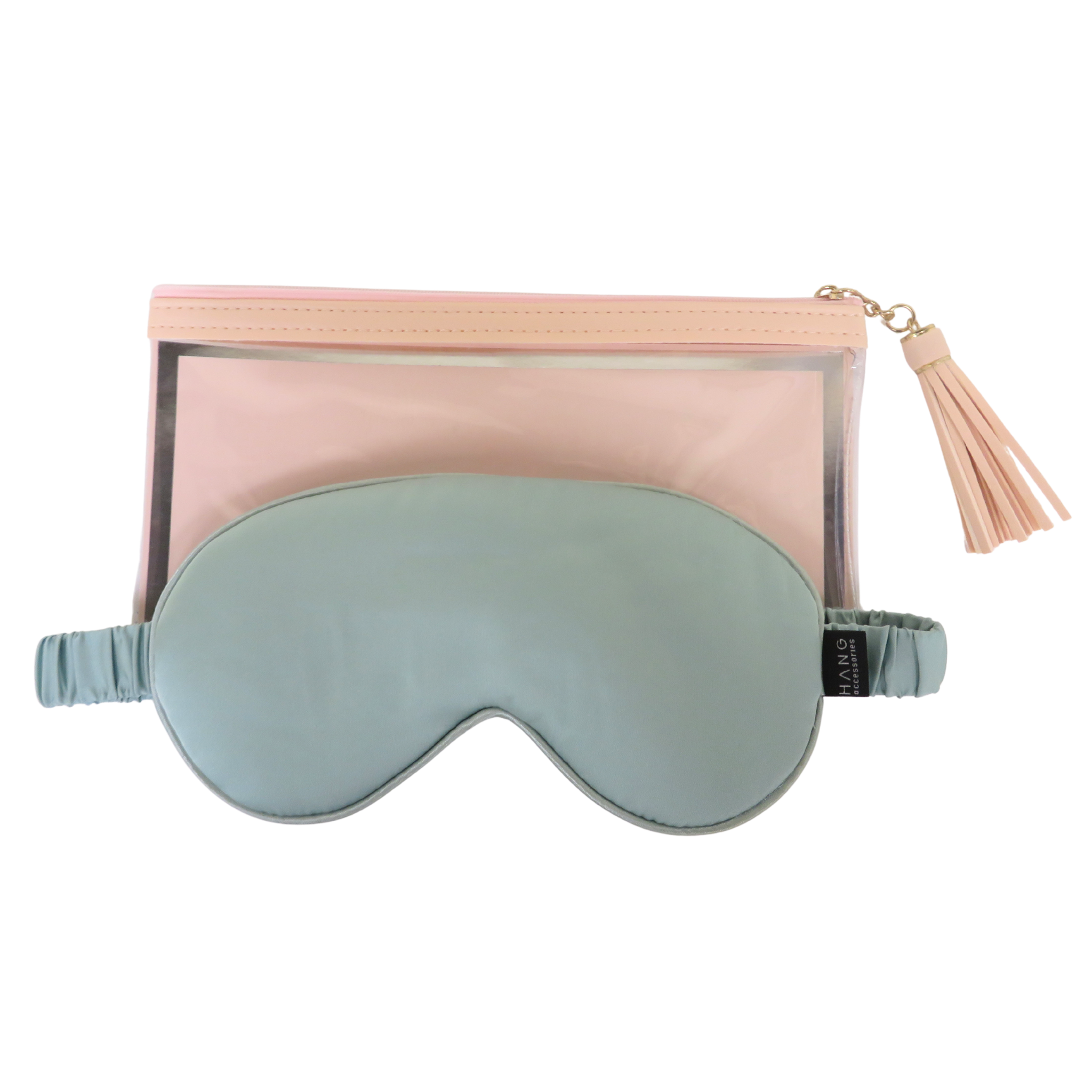 A seafoam sleep mask in front of a sheer blush pink zip pouch with a tassel zipper pull, shown on a plain white background.