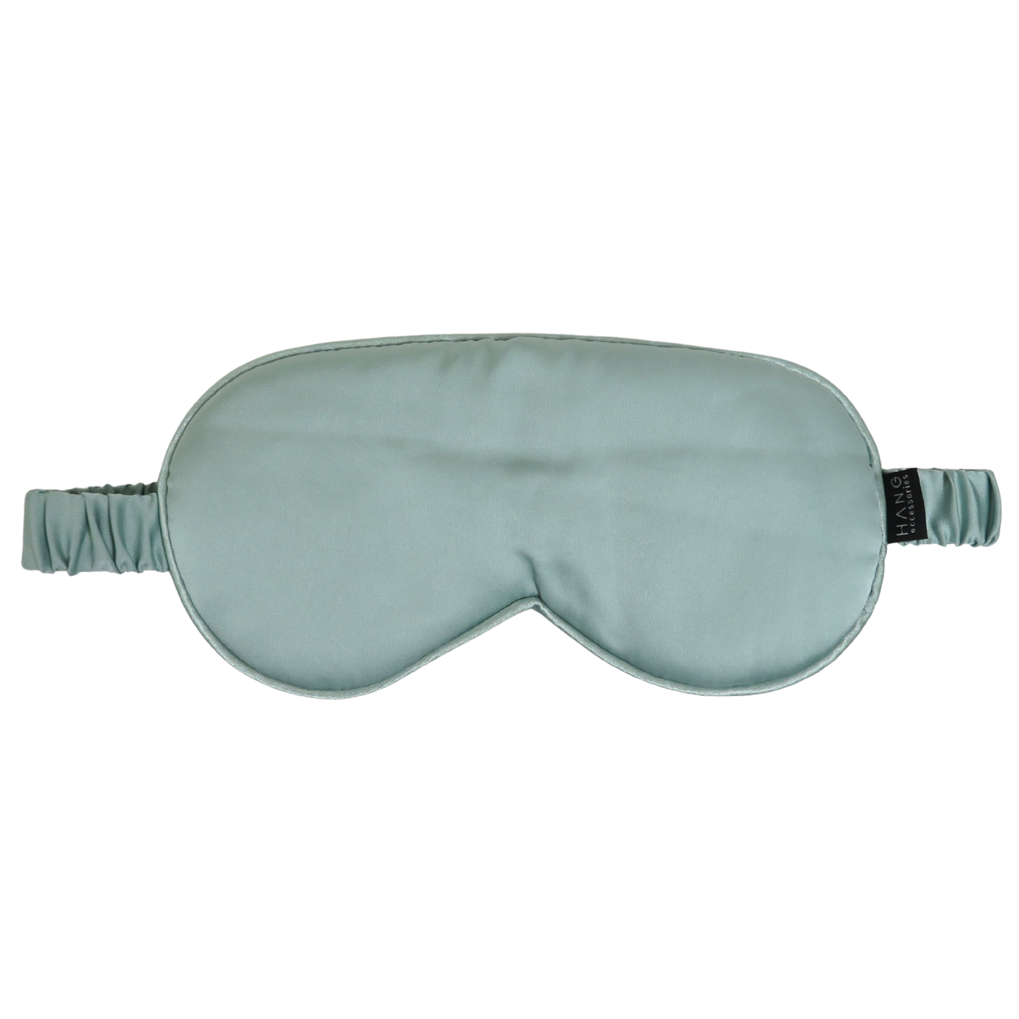 A sage green silk sleep mask with an elastic strap, shown against a plain white background.