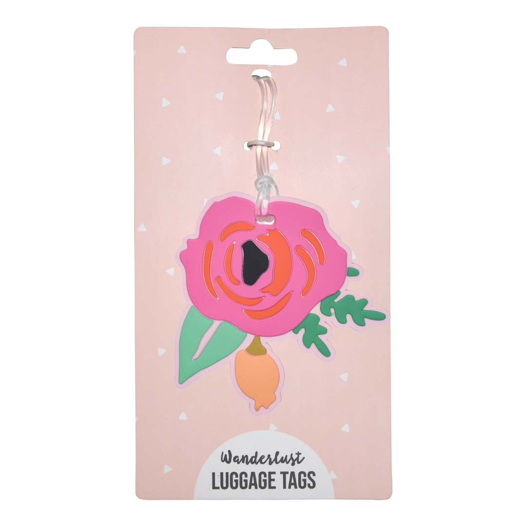 Pink floral silicone luggage tag with green leaves displayed on Wanderlust retail packaging